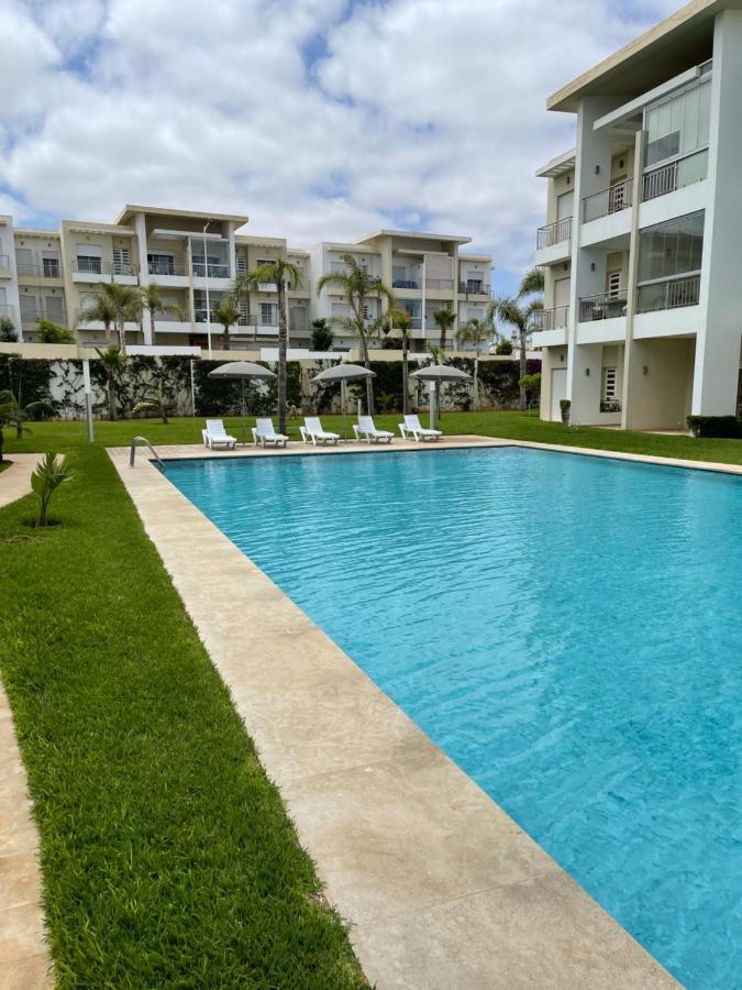 Bel appartement pied sur mer vue imprenable sur piscine et jardins Sidi Rahal  Extérieur photo