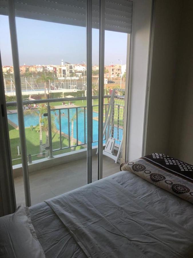 Bel appartement pied sur mer vue imprenable sur piscine et jardins Sidi Rahal  Extérieur photo